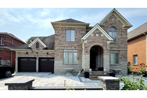 Exceptional 3 Car Tandem Garage Home with ravine backyard !