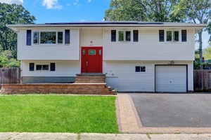 Discover modern living at 7 Walwin Place, a stunning hi ranch home situated on a quiet block in Huntington New York.