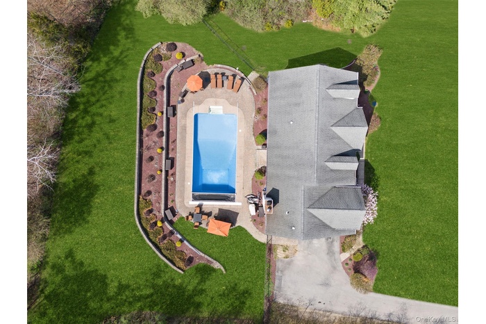 View of subject property featuring a pool area