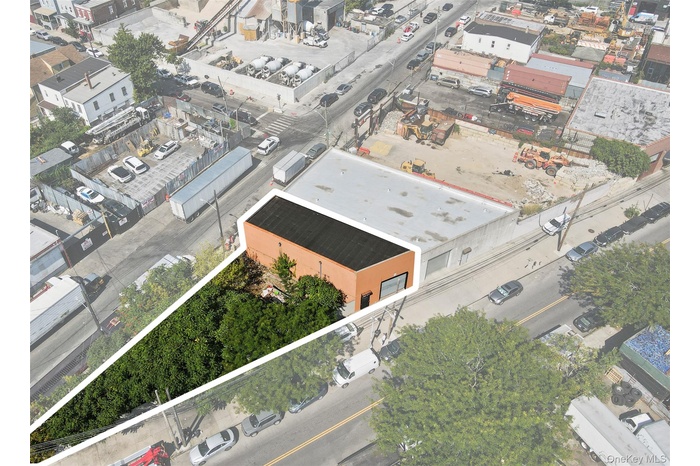 Aerial overview of property's location featuring property parcel outlined and an industrial area