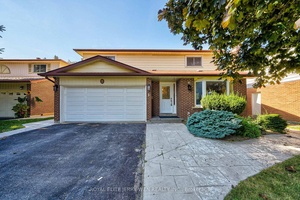 4 2 bedroom, 4 bathroom detached home with a double garage and wide frontage on a spacious lot offering exceptional curb appeal and extra outdoor space.
