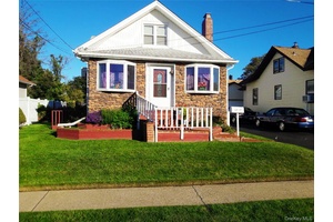 This stunning single family home offers 5 bedrooms and 3 full baths, featuring elegant hardwood floors throughout.