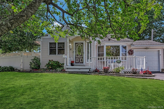 View of front of house featuring an attached garage and driveway