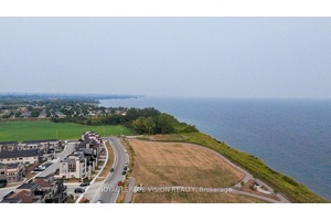 This stunning 3 bedroom, 3 bathroom townhouse is located in the prestigious Lakebreeze community, just steps from the beautiful shores of Lake Ontario.