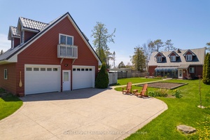 Nestled in the heart of the sought after Point Clark community, this charming lakefront home offers the perfect blend of curb appeal, functionality, and opportunity to make it your own.