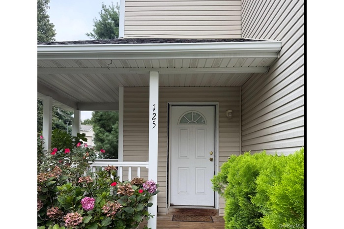 Property entrance featuring covered porch