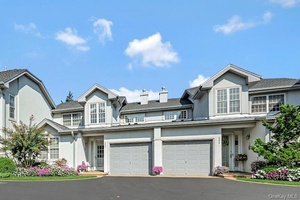 Designer owned and decorated unit is located in a private cul de sac at The Greens at Half Hollow.