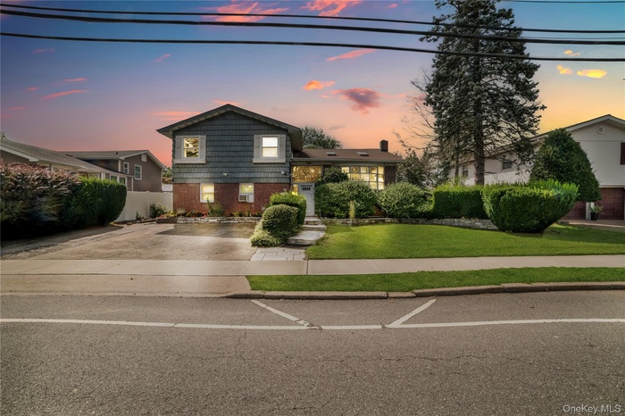 Tri-level home with brick siding