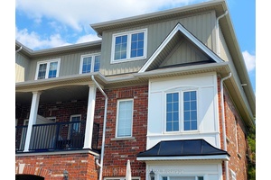 Great Price for this End Unit Rockefeller unit with private, owned parking directly in front.