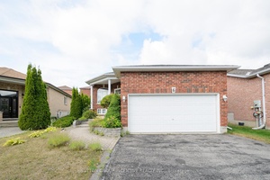 This stunning raised bungalow is tucked away in a quiet, family friendly neighborhood.