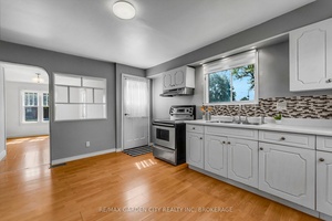 Unique hip style roofline construction in sought after Welland south, this 1.