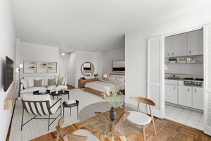 This 8th floor, light filled Greenwich Village studio offers stunning western views of the historic Jefferson Market Library.
