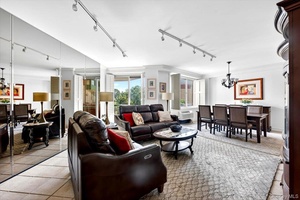 Welcome to the highly sought after Wyndham East in Garden City, offering luxury living with exceptional amenities including a doorman, indoor pool, sauna, gym, and valet service.
