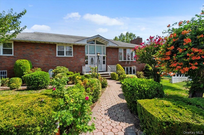 Beautiful brick home with landscapng