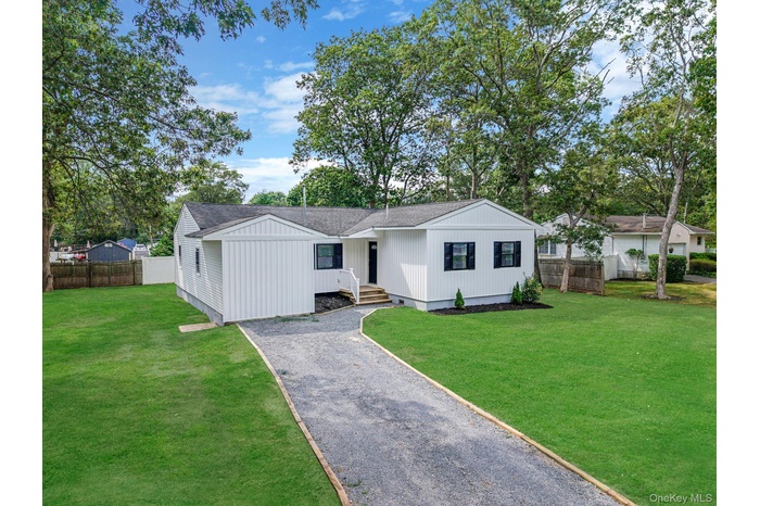 Ranch-style home featuring roof with shingles