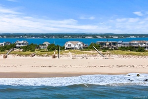 Set on 1 acre with 100 feet of direct ocean frontage, this shingled Post Modern has been renovated and reimagined for today's Hamptons living.
