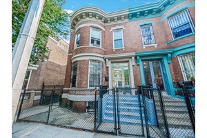 Classic and timeless barrel fronted brick semi detached two family on landmarked Manida Street in Hunts Point.