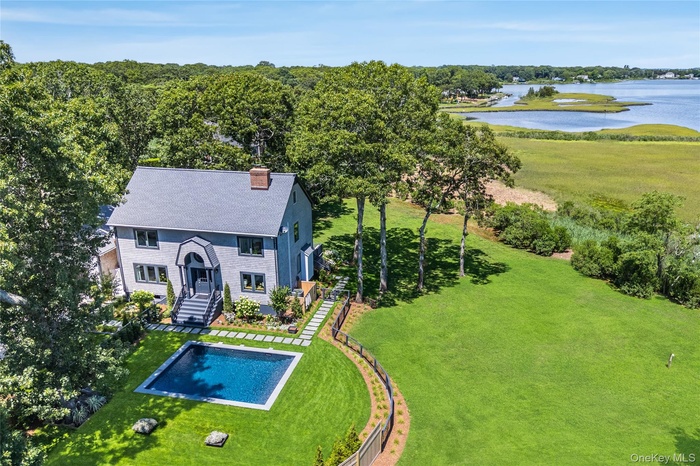 View from above of property with a nearby body of water