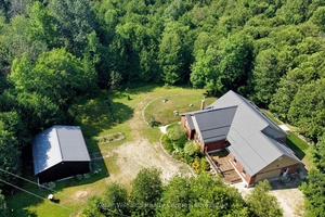 This 2006 brick bungalow sits on over 20 acres and comes complete with a 28' x 32' workshop, charming cottage, private pond, walking or ATV trails, and the beautiful Deer ...