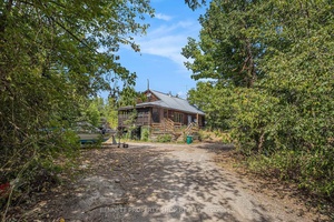 Discover the perfect blend of privacy and convenience on this fully treed 29 acre retreat, ideally located just minutes from Kanata and Highway 417.