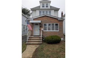 Lovely tree line colonial offers timeless charm with modern updates.