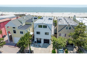 Step into coastal luxury with this impeccably updated 6 bedroom, 4 full bath, direct oceanfront home.