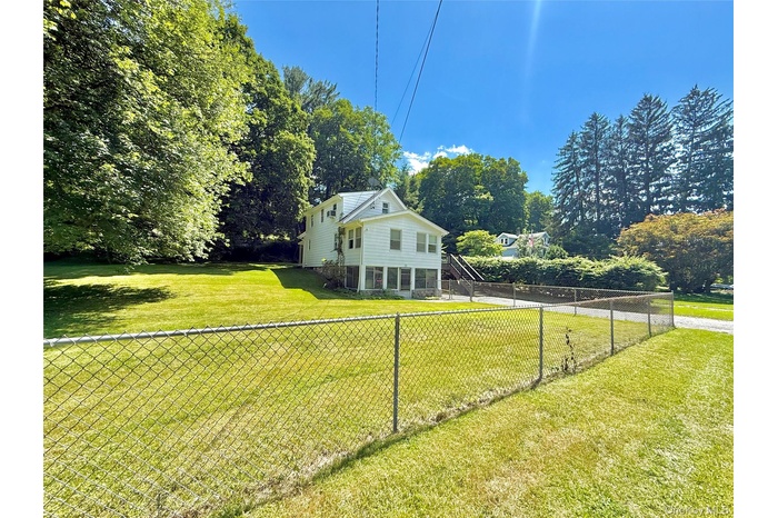 Fenced backyard with stairway