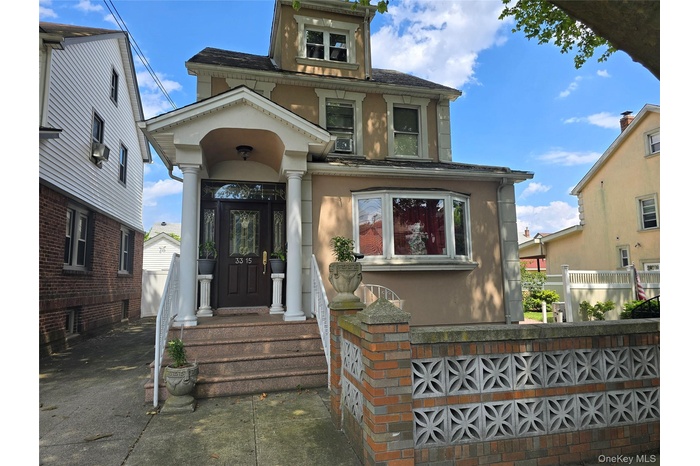 View of front of house featuring stucco siding