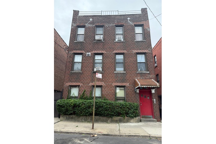 View of front of property featuring brick siding