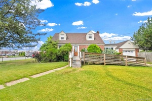 Welcome to 2347 Roosevelt Avenue in East Meadow, a spacious corner home offering comfort, functionality, and convenience.