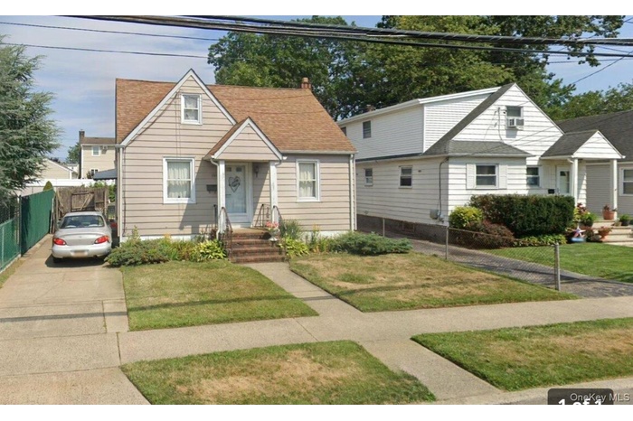 Bungalow-style house with a shingled roof