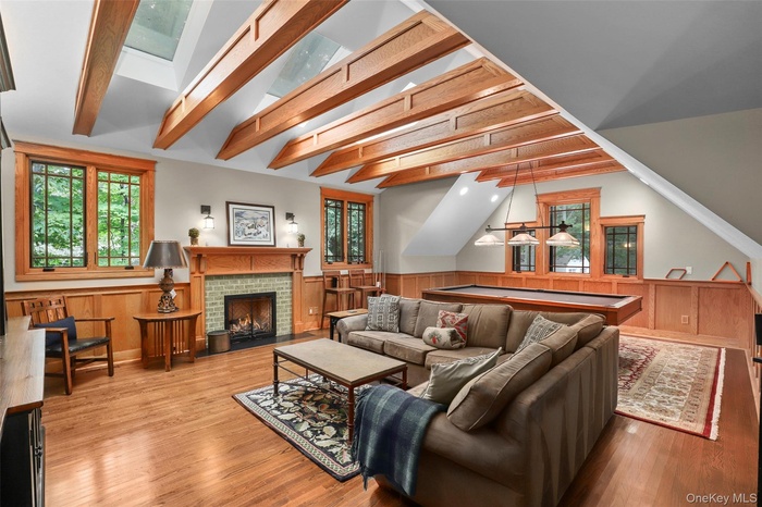 Upper level private game room includes billiards table, large flatscreen TV, gas-fireplace, and of course, games.