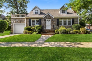Charming home situated on a desirable corner lot featuring a 1 car attached garage and inviting living room with a cozy fireplace.