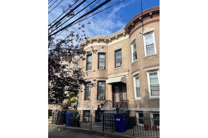 View of property featuring a fenced front yard