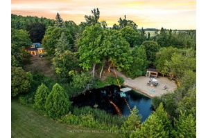 Spectacular 1 acre property with picturesque pond views, private beach, and your own tiki bar, with hydro !