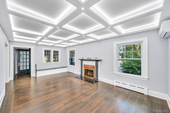 natural light, coffered ceiling,  newly lined chimney to fireplace
