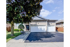 Welcome to this spacious and inviting raised bungalow, perfectly situated in the desirable Shades Mills neighborhood.