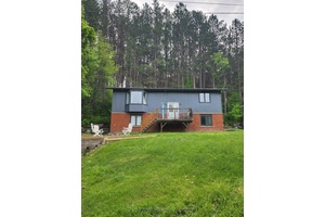 Perched perfectly across from the Magnetawan River with it's expansive 175 km's this updated raised bungalow is turn key ready and boastsalmost 2000 square feet of living space.