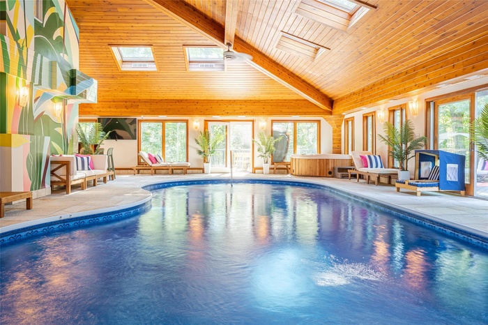 View of pool with a skylight