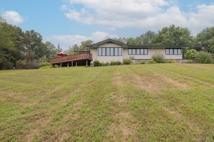 Escape to a world where architectural brilliance meets tranquil seclusion at 206 Hoslers Road.