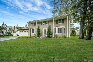 Welcome to this stunning Colonial style home in Farmingville, NY !