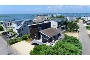 Nestled in one of the most sought after communities on Dune Road, this beloved beach home exudes classic seaside charm.
