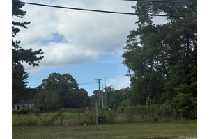 Located just steps from a popular shopping center and surrounded by dense residential neighborhoods, this parcel serves a stable and growing local population.