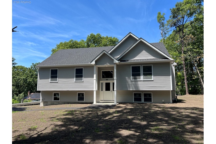 Raised ranch with roof with shingles