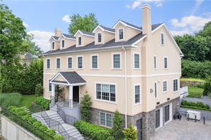 Modern elegance defines this stunning custom built home in Riverdale.