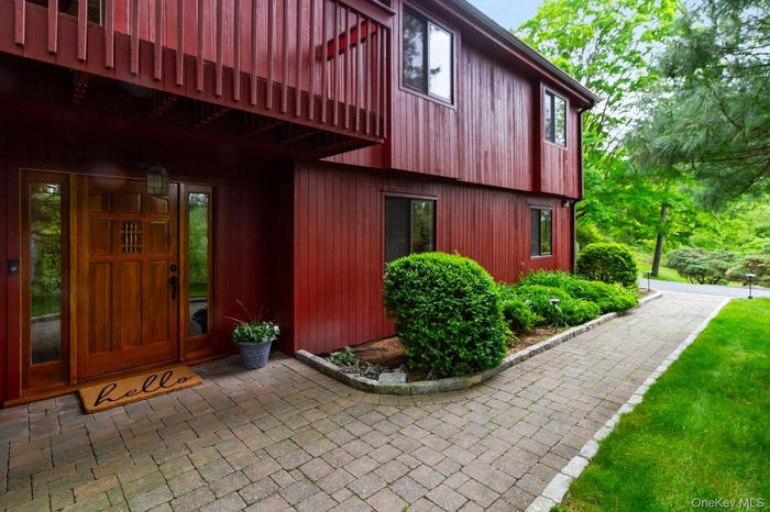 Tucked into a quiet cul-de-sac, yet in the center of everything, this meticulously maintained contemporary ranch offers the warm, woodsy elegance of a