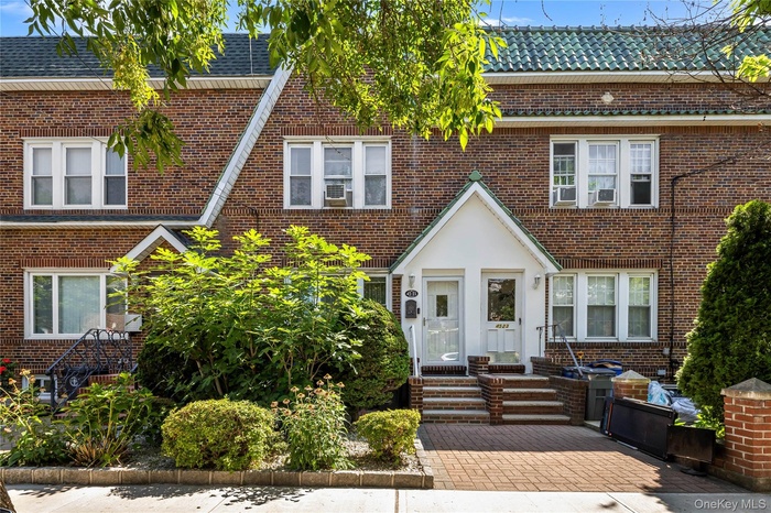 View of front of home with brick siding