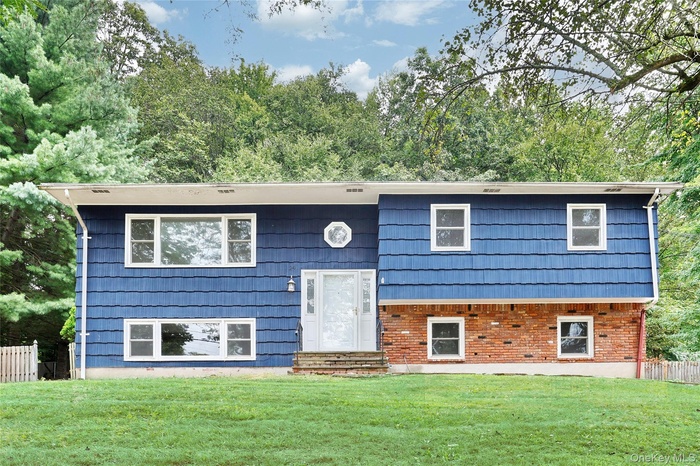 Bi-level home with brick siding