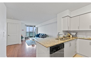 This one bedroom plus den condo, located in the sought after One Sherway Tower Three at 215 Sherway Gardens Road, was built by Menkes.