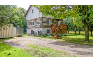 Discover the perfect escape in this beautifully maintained 3 bedroom log home, where rustic charm blends seamlessly with fresh, modern updates.